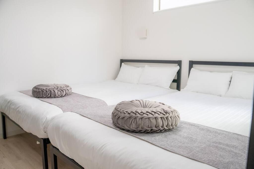 Residential Hotel Glitter Usjまで1駅5分 Osaka Værelse billede