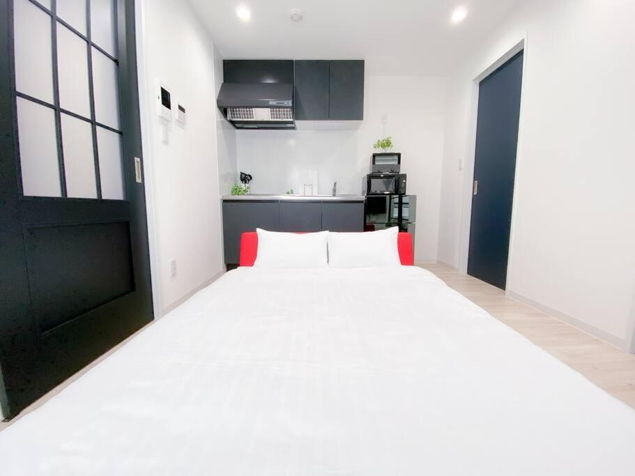 Residential Hotel Glitter Usjまで1駅5分 Osaka Værelse billede