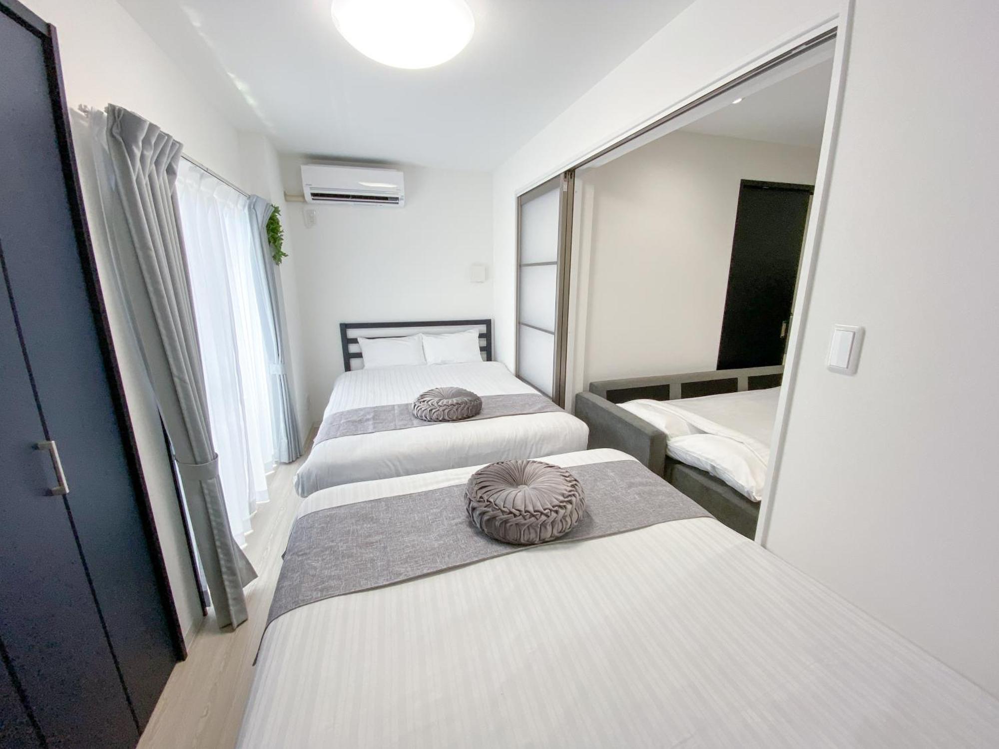 Residential Hotel Glitter Usjまで1駅5分 Osaka Værelse billede