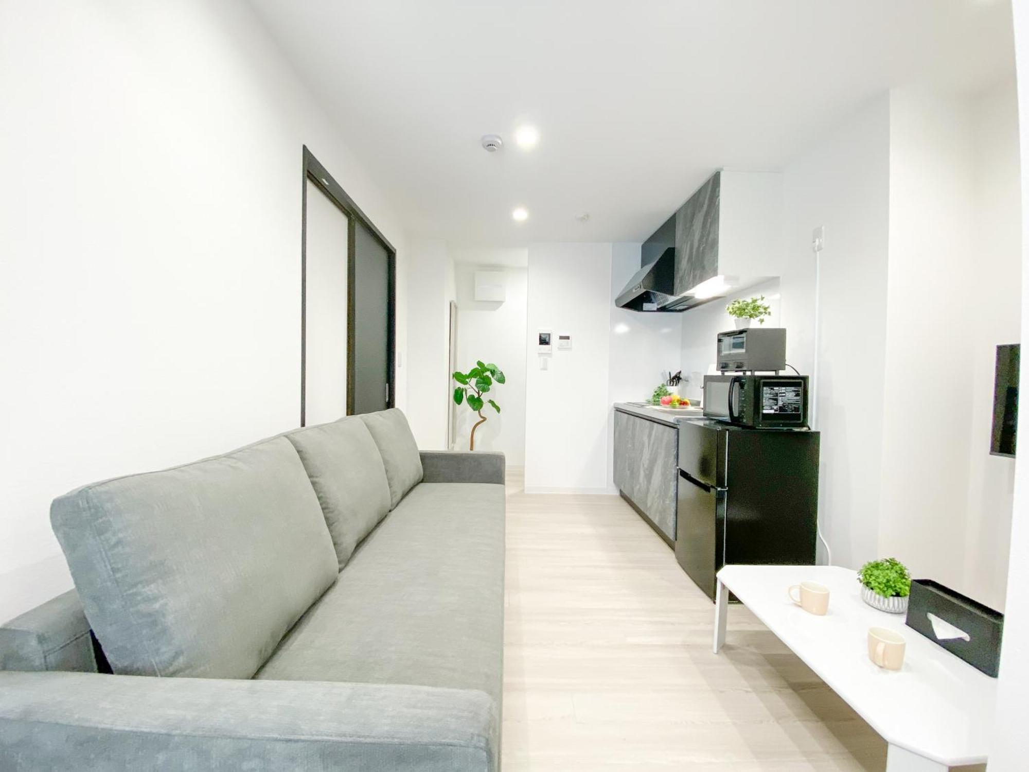Residential Hotel Glitter Usjまで1駅5分 Osaka Værelse billede