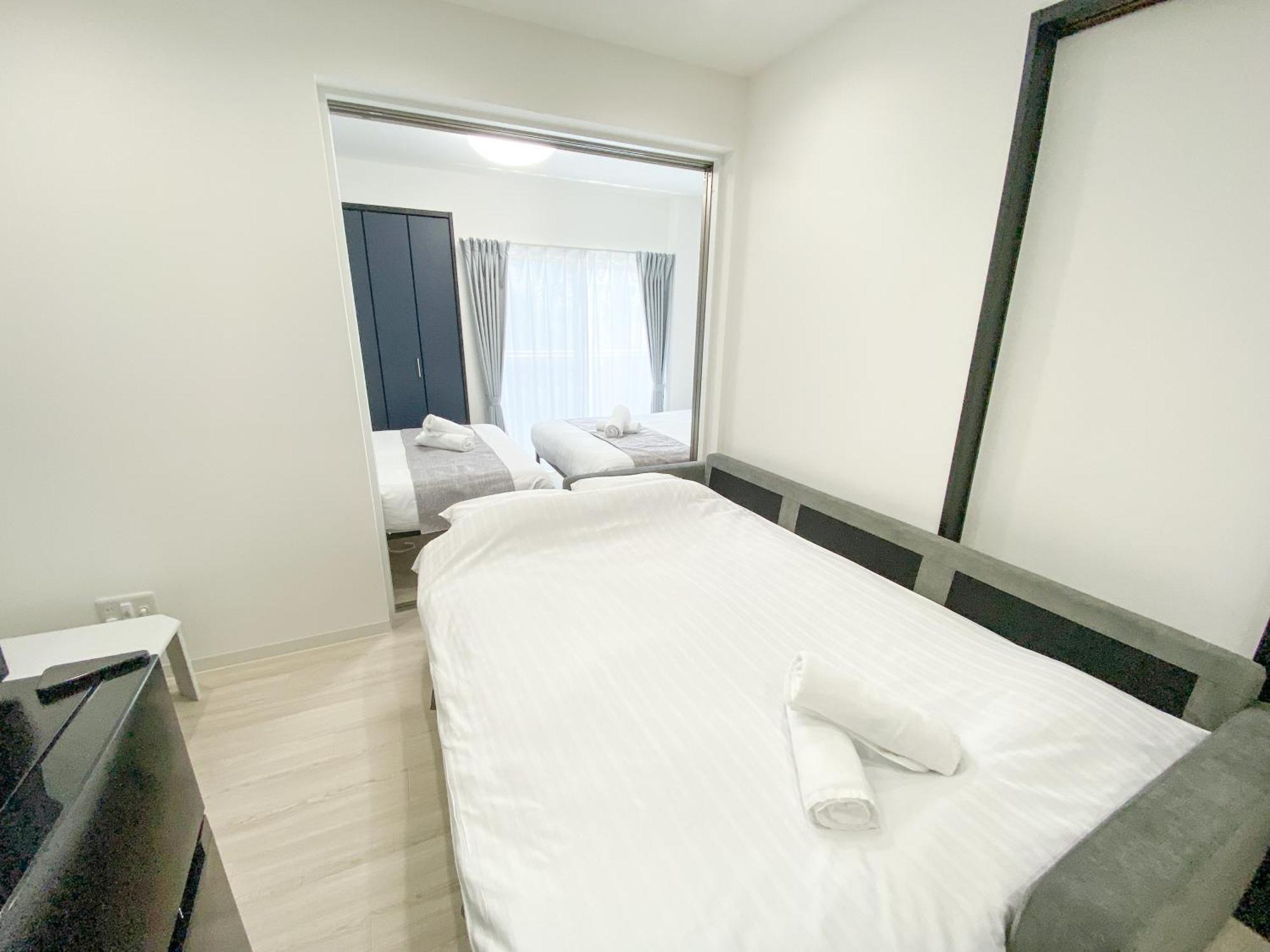 Residential Hotel Glitter Usjまで1駅5分 Osaka Værelse billede