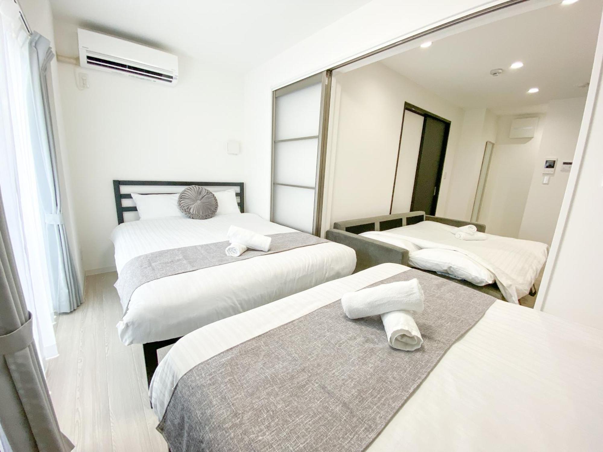 Residential Hotel Glitter Usjまで1駅5分 Osaka Værelse billede
